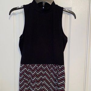 Black sleeveless top / tunic with pleated bottom